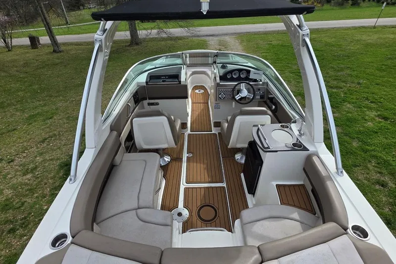 Slide: The Image of Interior view of 2011 Sea Ray SLX 250 boat with seating and helm. - 10