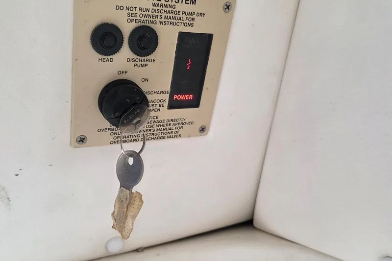 Slide: The Image of Control panel of a 2011 Sea Ray SLX 250 boat with key and warning label. - 19