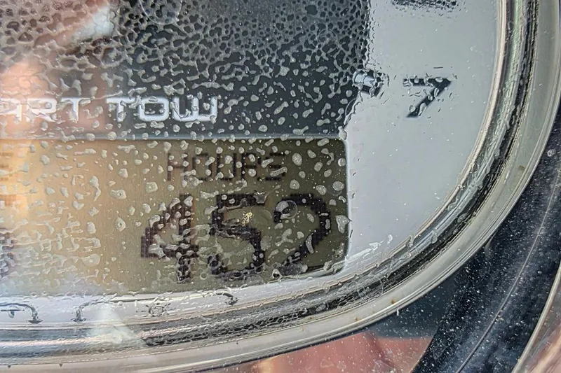 Slide: The Image of Close-up of a Sea Ray SLX 250 hour meter displaying 452 hours. - 25