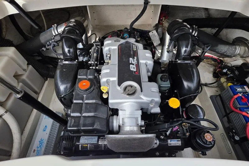 Slide: The Image of Engine compartment of a 2011 Sea Ray SLX 250 boat, featuring a powerful engine. - 26
