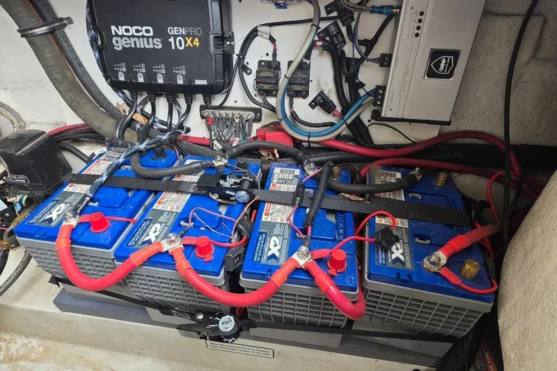 Slide: The Image of Battery setup in a 2011 Sea Ray SLX 250 boat with Noco Genius charger. - 27