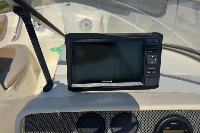 Slide: The Image of Garmin GPS device on 2004 Scout 175 Dorado boat dashboard, featuring Yamaha tachometer. - 17