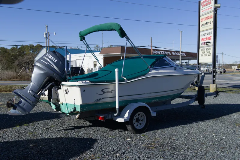 Slide: The Image of 2004 Scout 175 Dorado boat with Yamaha motor on trailer at marina. - 4