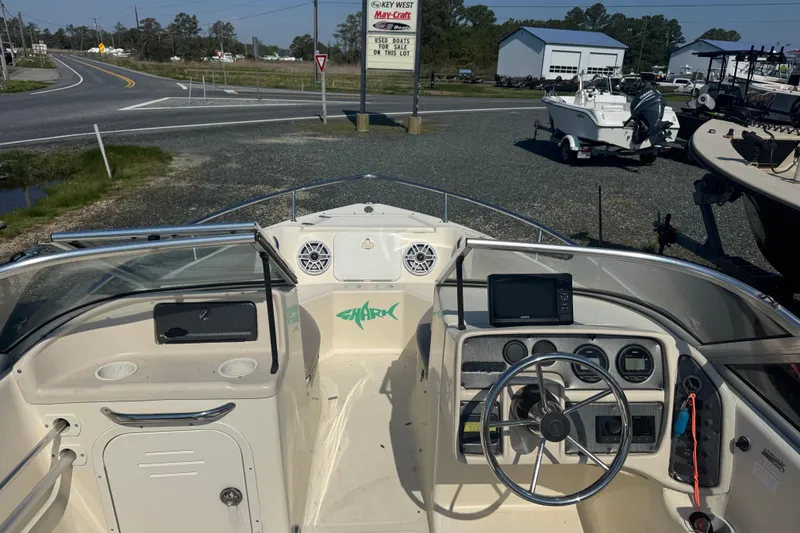 Slide: The Image of 2004 Scout 175 Dorado boat interior with steering wheel and dashboard controls. - 8