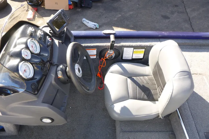 Slide: The Image of 2021 Tracker Pro 170 boat cockpit with steering wheel and gauges. - 10