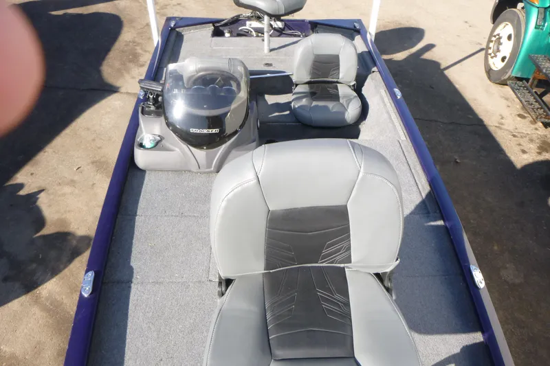 Slide: The Image of 2021 Tracker Pro 170 boat interior with seating and steering console. - 6