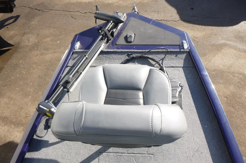 Slide: The Image of 2021 Tracker Pro 170 boat interior with gray seat and trolling motor. - 7