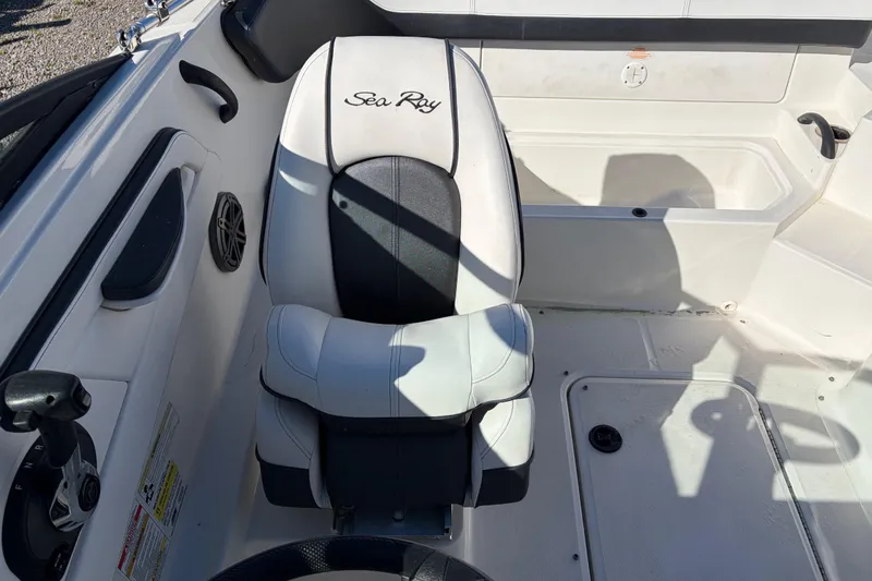 Slide: The Image of 2015 Sea Ray 19 SPX boat interior with white and black seating. - 11