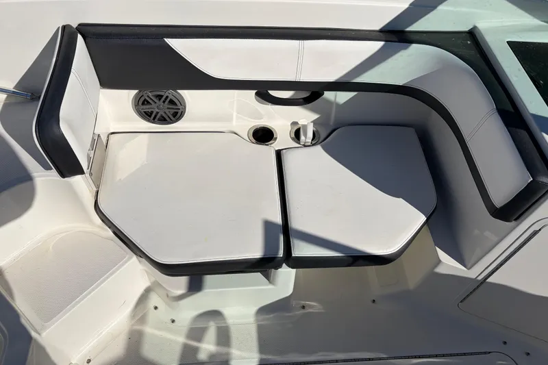 Slide: The Image of 2015 Sea Ray 19 SPX boat interior seating with cup holders and speaker. - 12