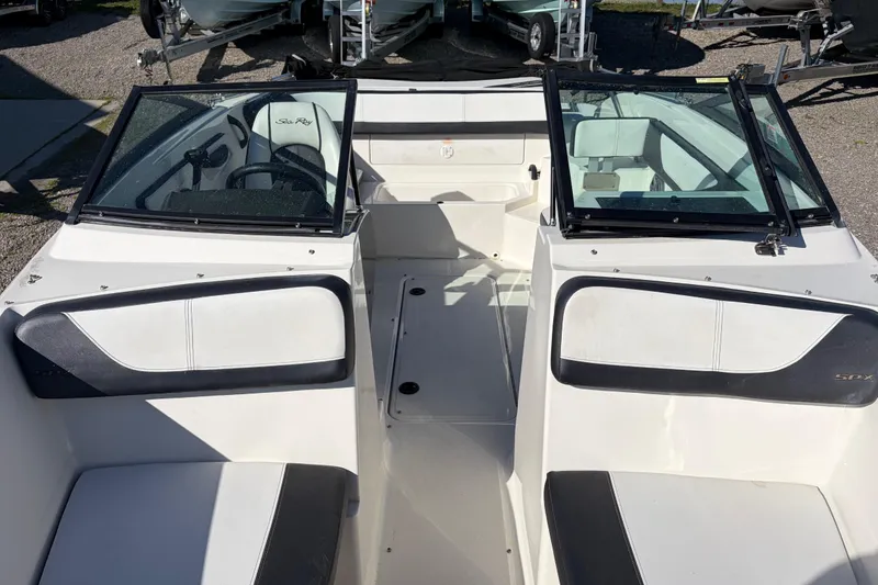 Slide: The Image of 2015 Sea Ray 19 SPX boat interior with seating and windshield. - 14