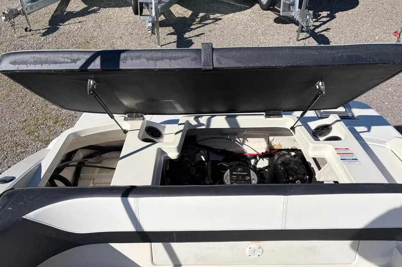 Slide: The Image of Open engine compartment of a 2015 Sea Ray 19 SPX boat, showing engine details. - 19