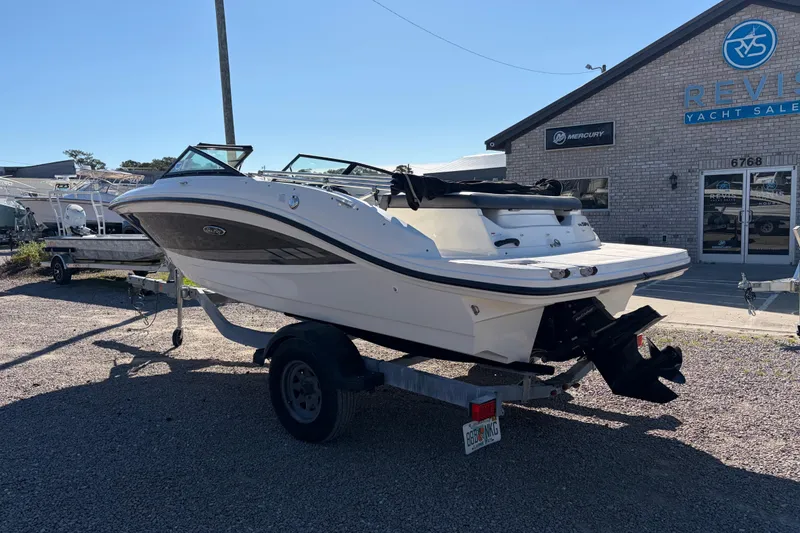 Slide: The Image of 2015 Sea Ray 19 SPX boat on trailer at yacht sales lot. - 2