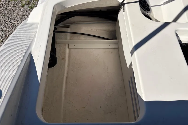 Slide: The Image of Storage compartment of a 2015 Sea Ray 19 SPX boat, showing interior details. - 20