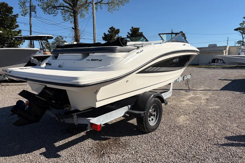 Slide: The Image of 2015 Sea Ray 19 SPX boat on trailer in outdoor setting. - 4