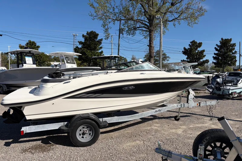 Slide: The Image of 2015 Sea Ray 19 SPX boat on trailer in outdoor dealership lot. - 5