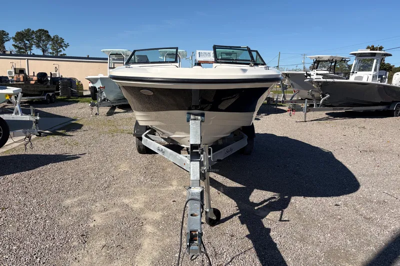 Slide: The Image of 2015 Sea Ray 19 SPX boat on trailer in outdoor lot. - 7