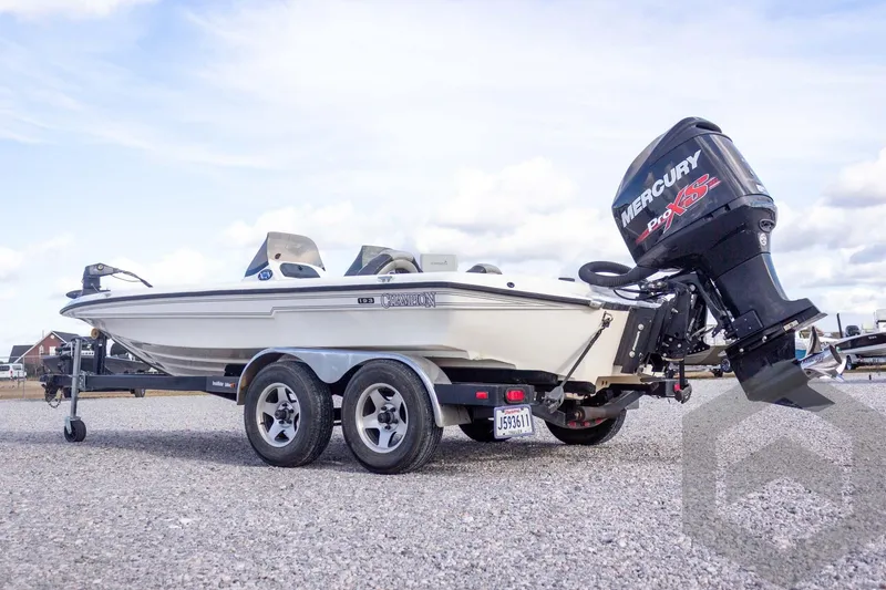 Slide: The Image of 2000 Champion 193 CX boat with Mercury Pro XS engine on trailer. - 10