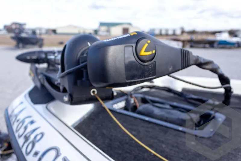 Slide: The Image of Close-up of a 2000 Champion 193 CX boat motor control on a trailer. - 13