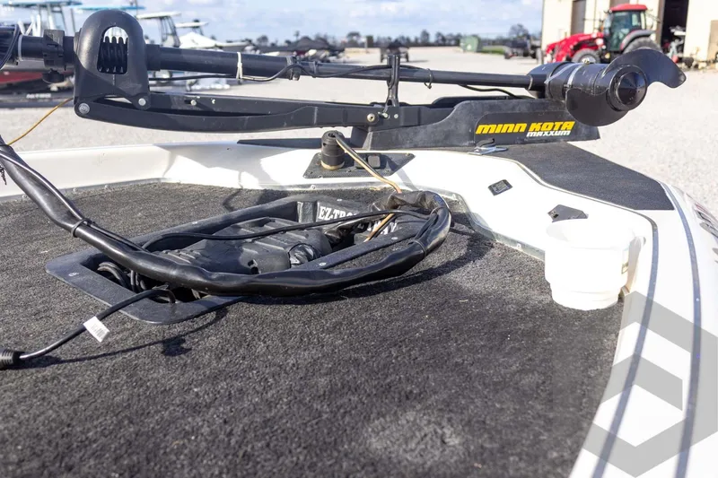 Slide: The Image of 2000 Champion 193 CX boat with Minn Kota trolling motor on deck. - 15