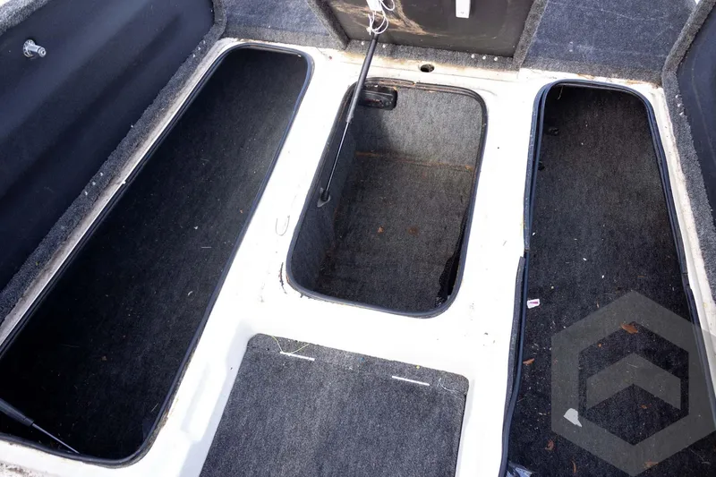 Slide: The Image of Interior view of a 2000 Champion 193 CX boat storage compartments. - 20