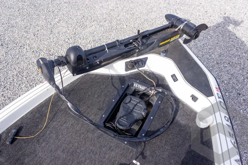 Slide: The Image of 2000 Champion 193 CX boat deck with trolling motor and control panel. - 21