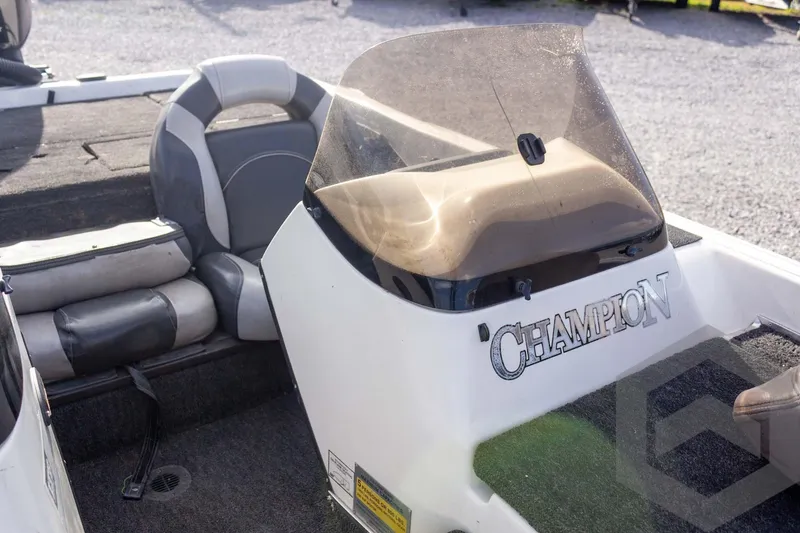 Slide: The Image of 2000 Champion 193 CX boat interior with seating and windshield. - 24