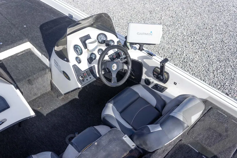 Slide: The Image of Cockpit of a 2000 Champion 193 CX boat with Garmin navigation system. - 25