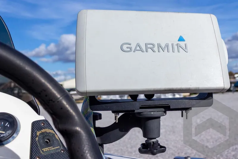 Slide: The Image of Garmin GPS device mounted on a 2000 Champion 193 CX boat dashboard. - 32