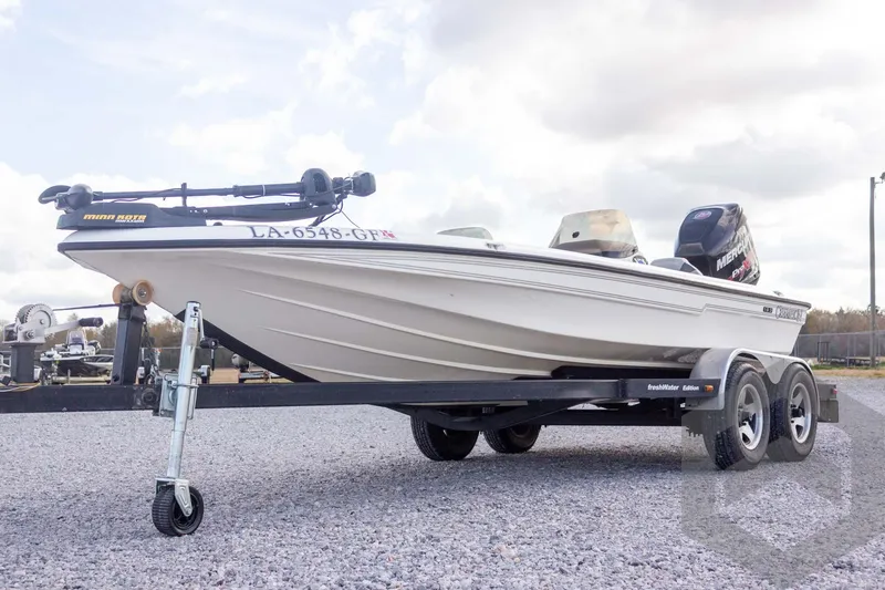 Slide: The Image of 2000 Champion 193 CX boat on trailer, featuring Minn Kota trolling motor. - 4