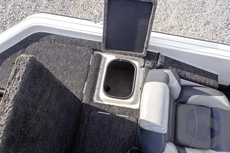 Slide: The Image of Open storage compartment in 2000 Champion 193 CX boat interior. - 42