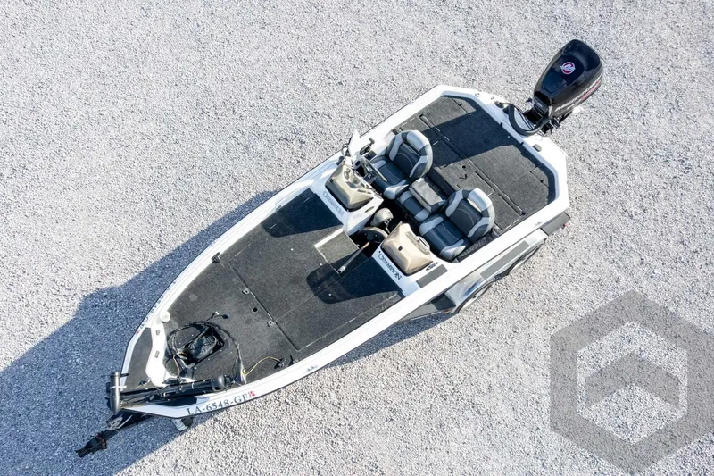 Slide: The Image of Aerial view of a 2000 Champion 193 CX boat on gravel surface. - 45