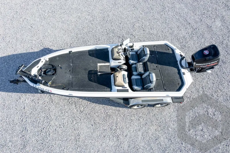 Slide: The Image of Aerial view of 2000 Champion 193 CX boat on gravel surface. - 46