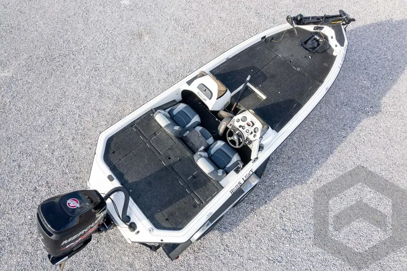Slide: The Image of 2000 Champion 193 CX fishing boat with dual seats and Mercury outboard motor. - 49