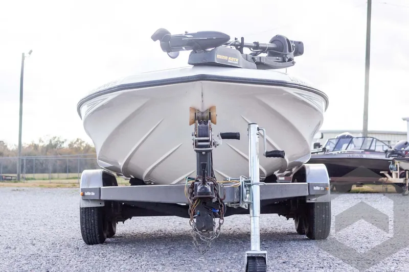 Slide: The Image of Front view of a 2000 Champion 193 CX boat on a trailer. - 5