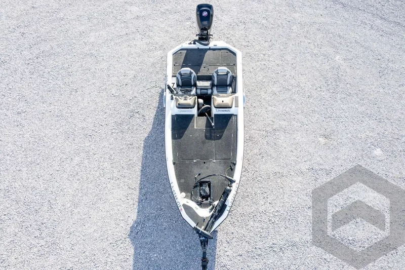 Slide: The Image of Aerial view of a 2000 Champion 193 CX boat on gravel surface. - 52