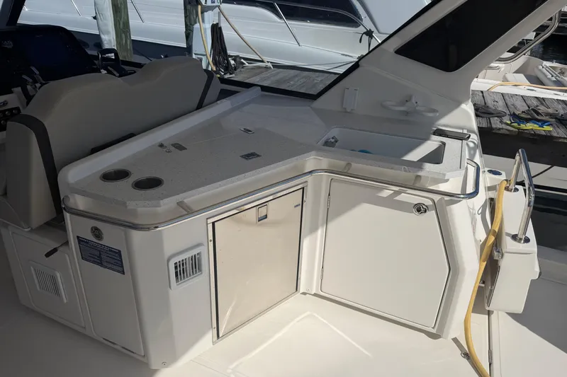 Slide: The Image of 2023 Aquila 36 Sport yacht interior with kitchenette and seating area. - 10
