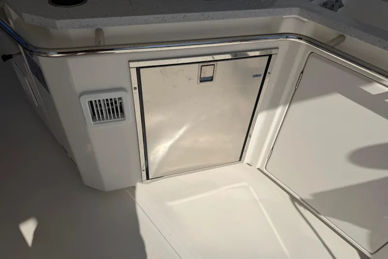 Slide: The Image of Aquila 36 Sport 2023 boat interior with stainless steel storage compartment. - 12