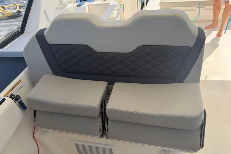 Slide: The Image of Gray leather seating on 2023 Aquila 36 Sport boat, featuring quilted backrest design. - 22