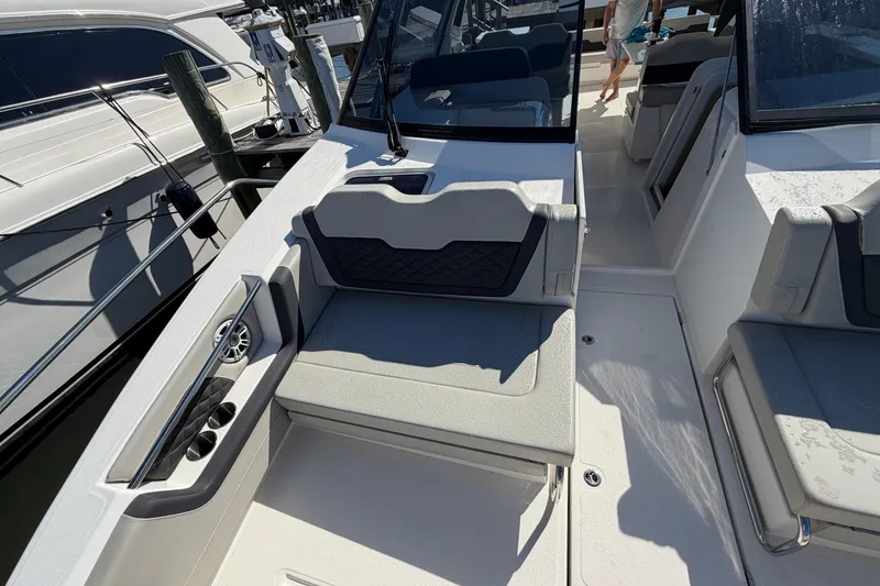 Slide: The Image of 2023 Aquila 36 Sport boat interior with seating and cup holders. - 33