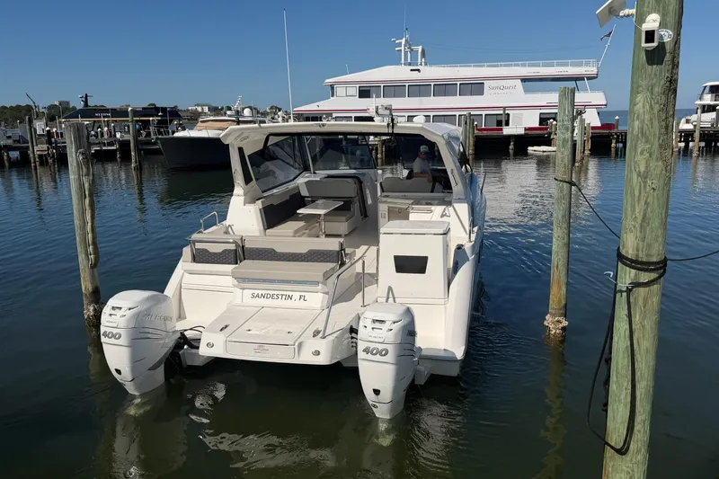 Slide: The Image of 2023 Aquila 36 Sport boat docked in Sandestin, Florida marina. - 4