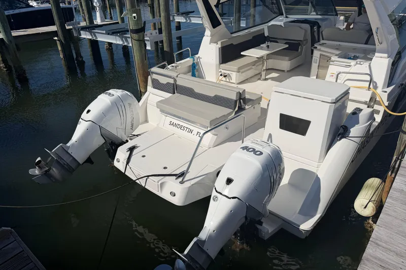 Slide: The Image of 2023 Aquila 36 Sport boat docked with twin outboard engines in Sandestin, Florida. - 5