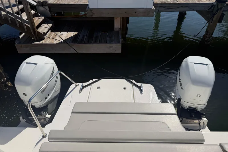 Slide: The Image of Aquila 36 Sport 2023 boat with dual Mercury outboard engines at dock. - 6