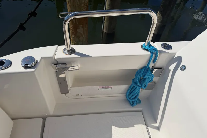 Slide: The Image of 2023 Aquila 36 Sport boat deck with blue rope and stainless steel railing. - 8