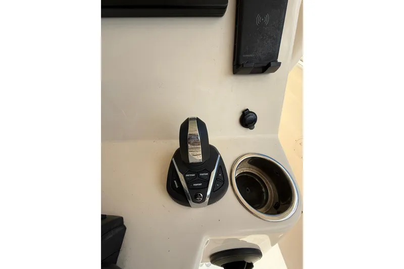 Slide: The Image of Control panel of 2021 Grady-White Canyon 336 boat with joystick and cup holder. - 30
