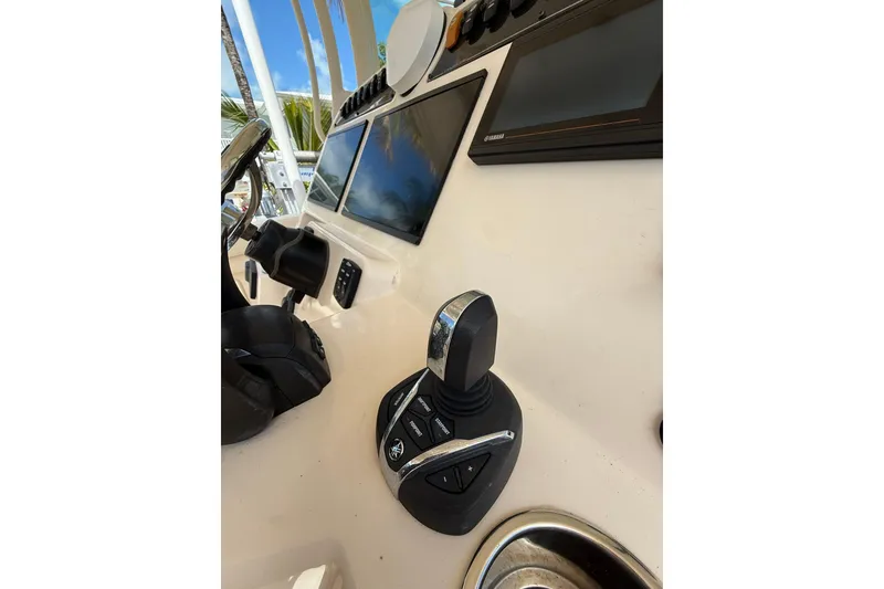 Slide: The Image of Control panel of 2021 Grady-White Canyon 336 boat with joystick and screens. - 31
