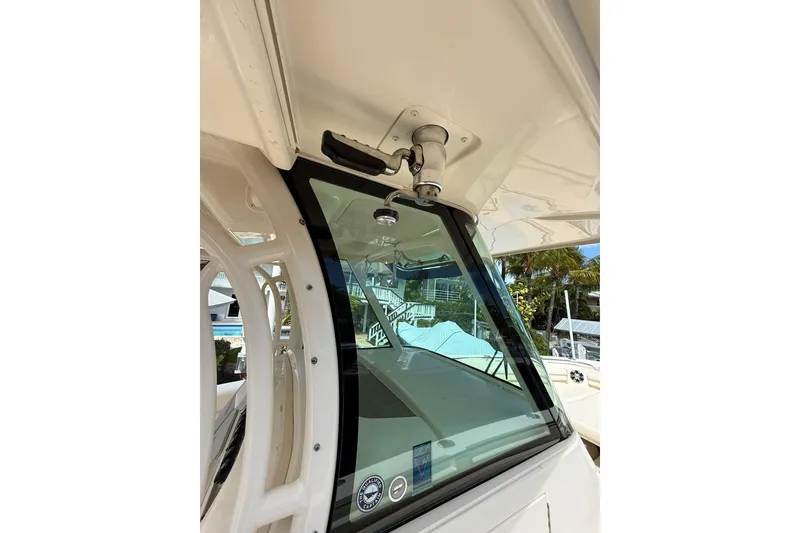 Slide: The Image of 2021 Grady-White Canyon 336 boat windshield and roof detail. - 34