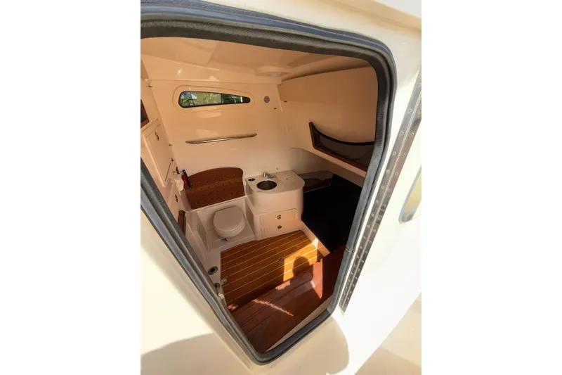 Slide: The Image of Interior cabin of 2021 Grady-White Canyon 336 boat, featuring seating and amenities. - 47
