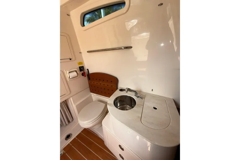 Slide: The Image of 2021 Grady-White Canyon 336 boat bathroom with sink and toilet. - 51