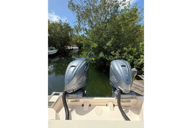 Slide: The Image of 2021 Grady-White Canyon 336 boat with twin Yamaha outboard motors in a scenic waterway. - 9