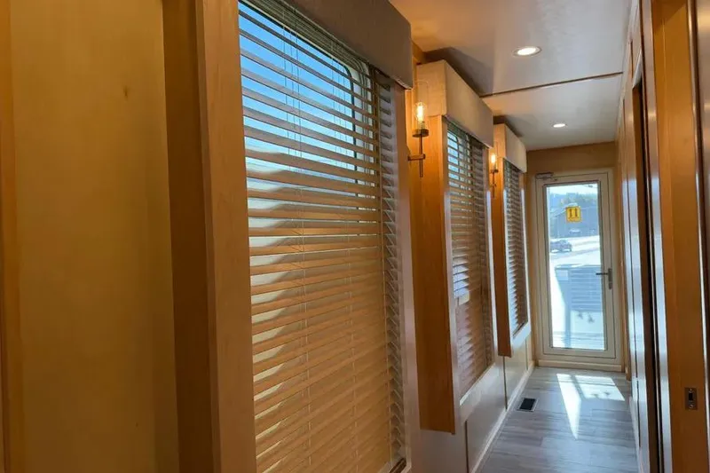 Slide: The Image of Interior hallway of 2026 Sumerset Voyager with wooden blinds and modern lighting. - 12